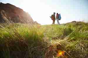 Free photo couple enjoying hiking vacation