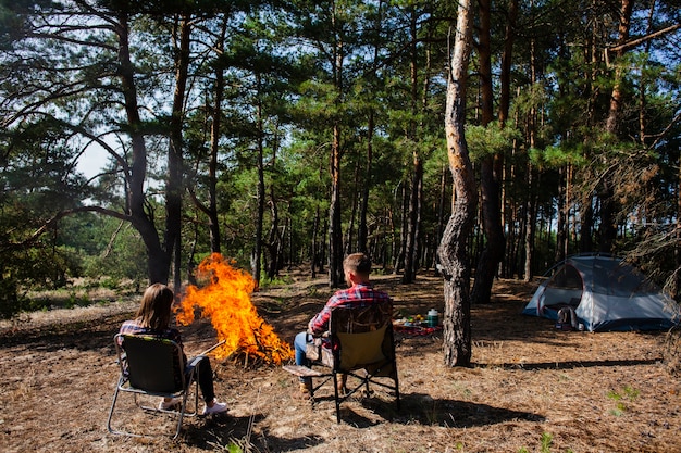 Free Photo couple enjoying the night at fire light