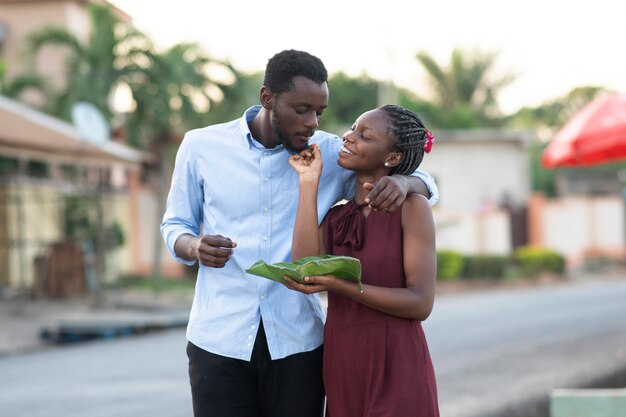 Couple enjoying some street food together