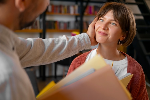 Free Photo couple enjoying their bookstore date