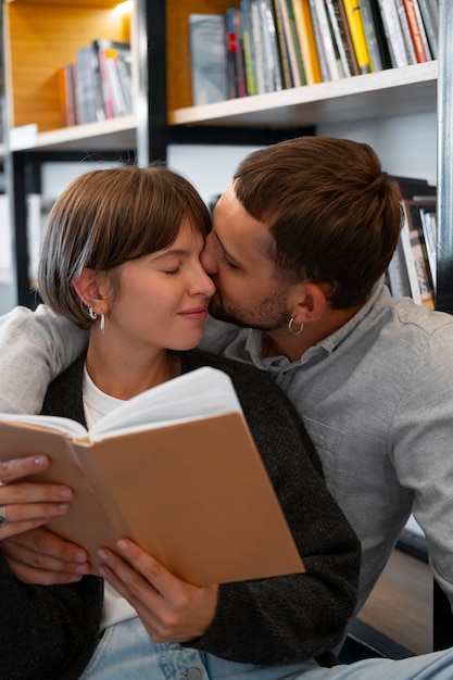 Free photo couple enjoying their bookstore date