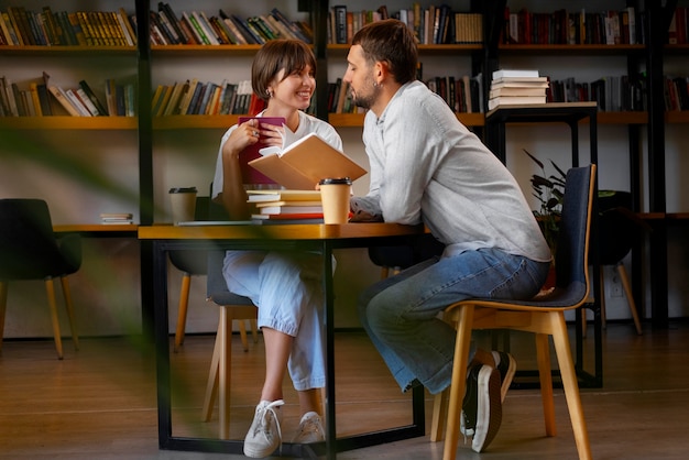 Free photo couple enjoying their bookstore date