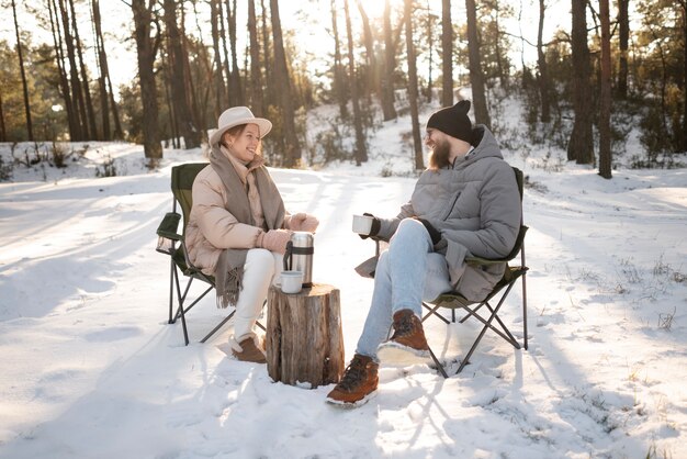 Couple enjoying their winter camp