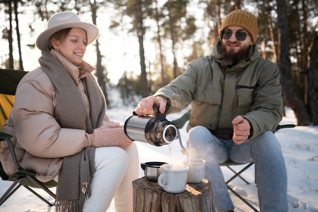 Couple enjoying their winter camp