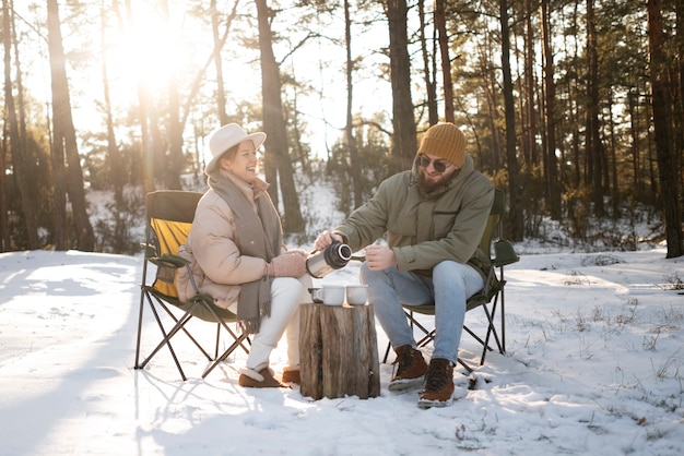 Couple enjoying their winter camp