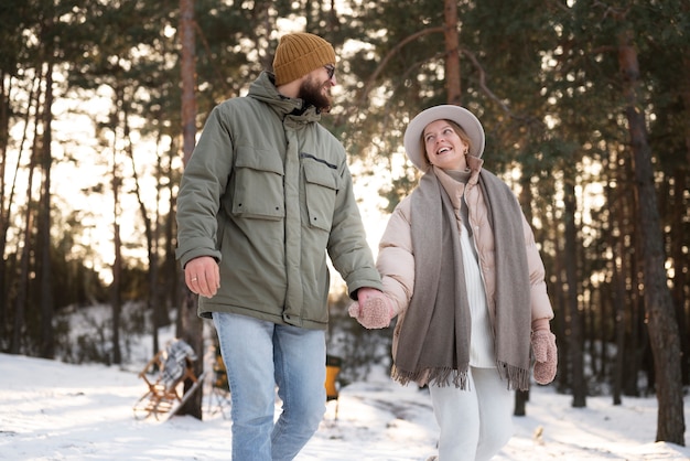 Free Photo couple enjoying their winter camp