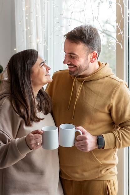 Free Photo couple enjoying winter home lifestyle