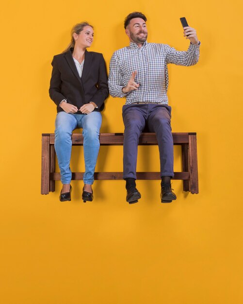 Free Photo couple floating on a bench