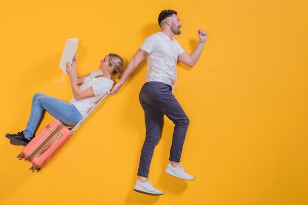 Free photo couple floating with a trolley