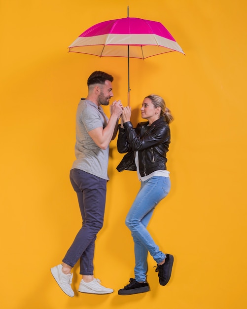 Couple floating with an umbrella