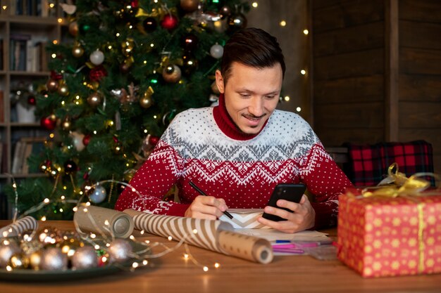 Couple giving each other christmas gifts