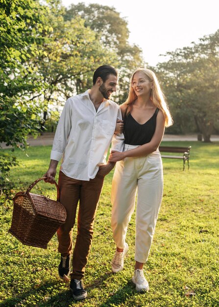 Couple going to the park to have a picnic