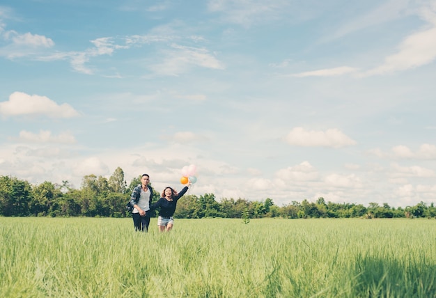 Couple in a greenfield