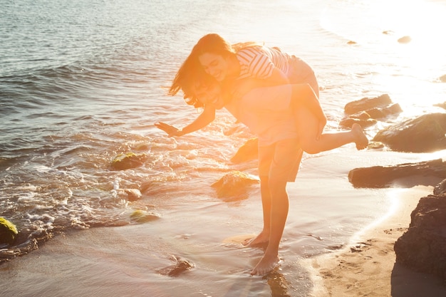 Free photo couple having fun at the beach