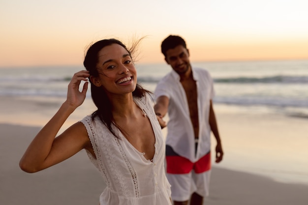 Couple having fun together on the beach