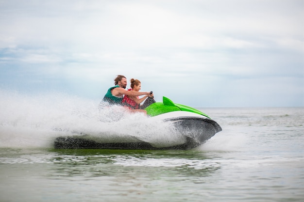 Free photo couple having fun on water scooter summer sea activity