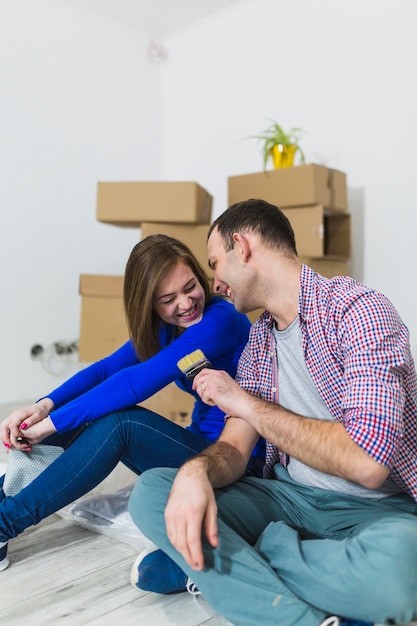 Couple having fun with brush