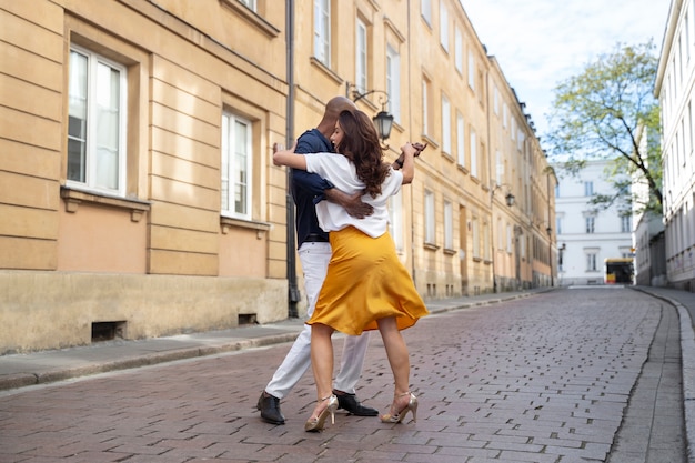 Couple having a latin dance performance in the city