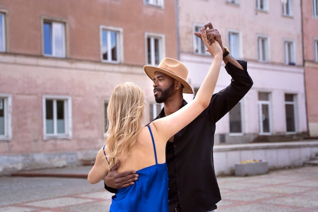 Couple having a latin dance performance in the city