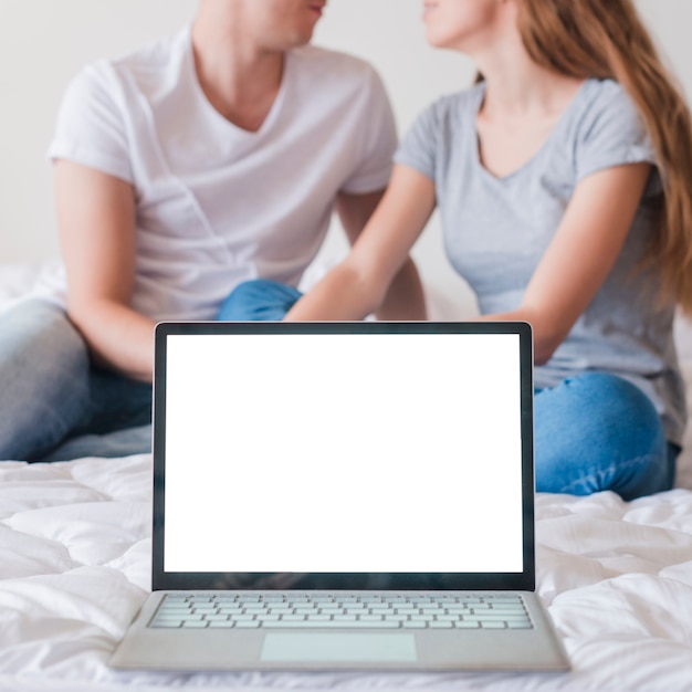 Couple having romantic moments instead of using device