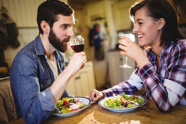 Couple having wine and breakfast