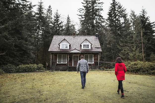 Couple heading to forest shack