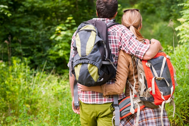 Free photo couple hiking in the forest