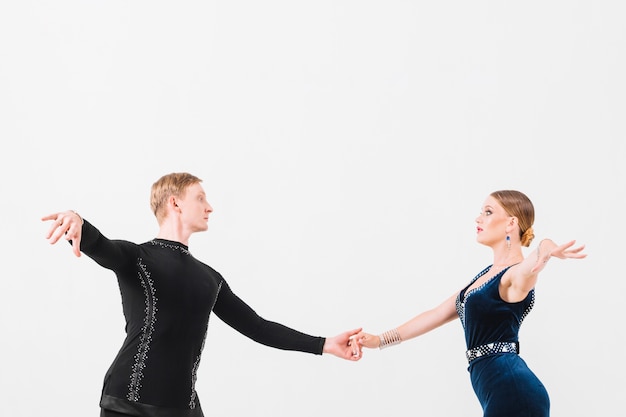 Free photo couple holding hands and dancing