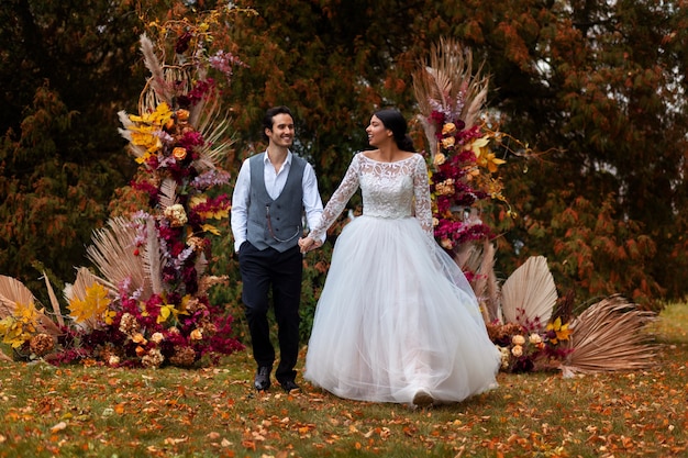 Couple holding hands front view