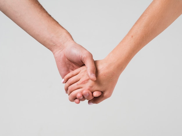 Free photo couple holding hands for valentines day