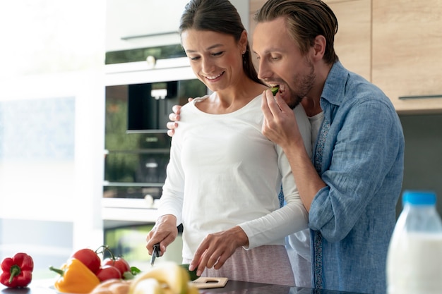 Couple at home cooking togheter