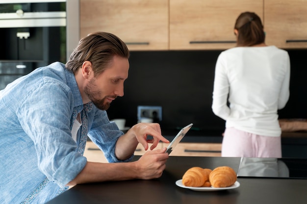 Couple at home doing house chores