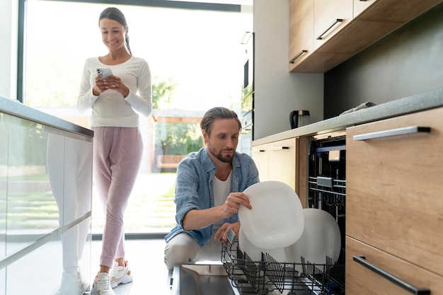 Couple at home doing house chores