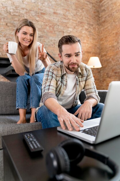 Couple at home having videocall with family