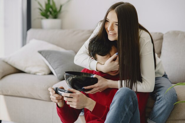 Couple at home playing video games