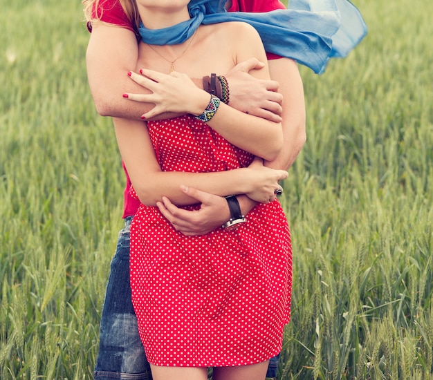 Free photo couple hugging in a meadow