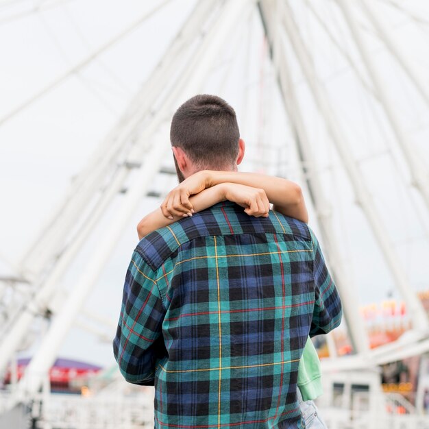 Couple hugging outdoors