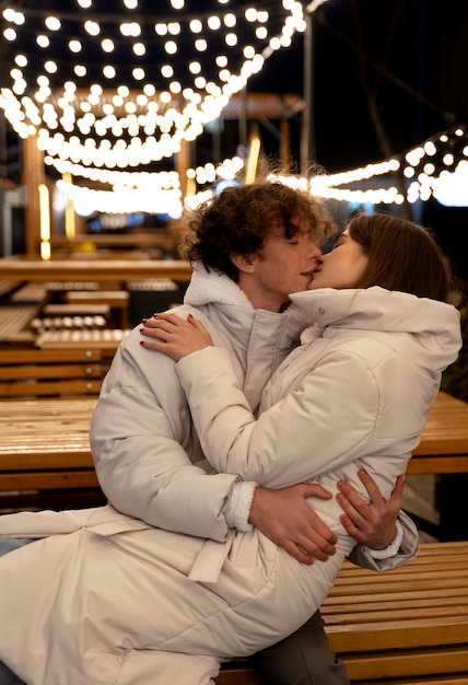 Couple kissing outdoors while embracing