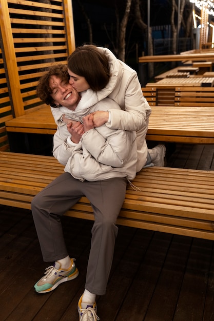 Couple kissing outdoors while embracing