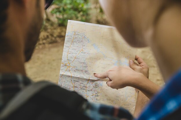 Couple looking at map close up