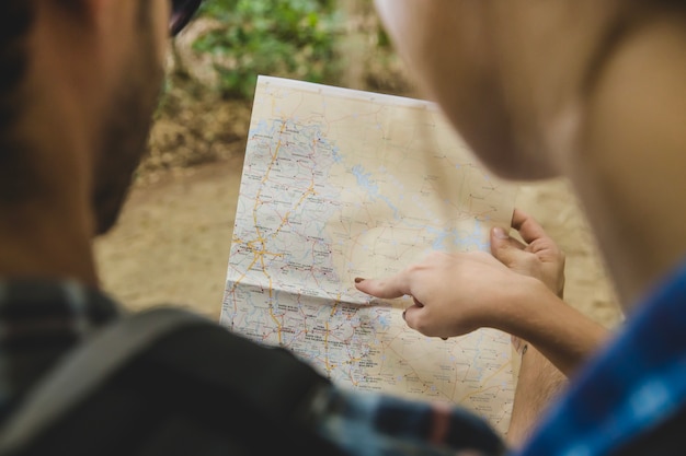 Couple looking at map close up