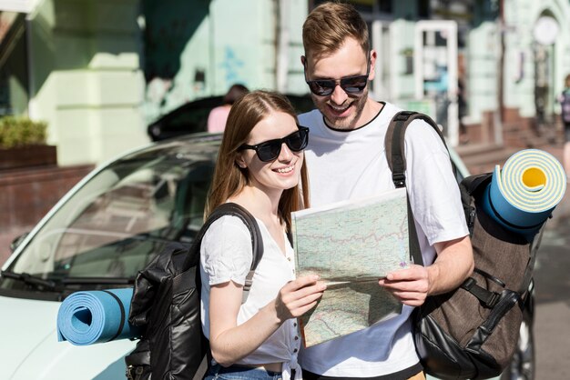 Couple looking at map while traveling