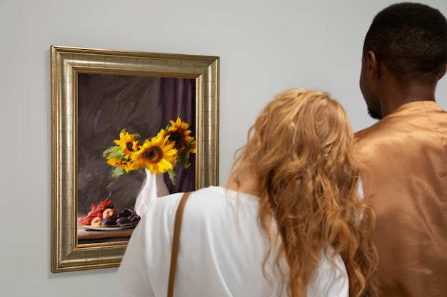 Couple looking at painting back view