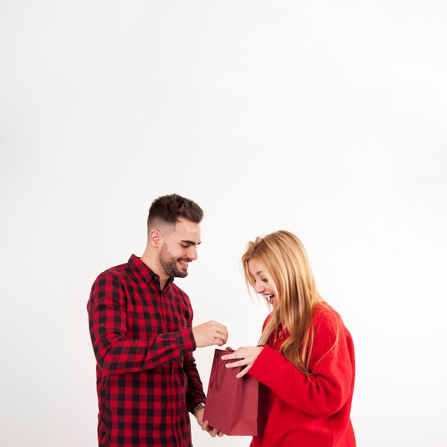 Couple looking at present