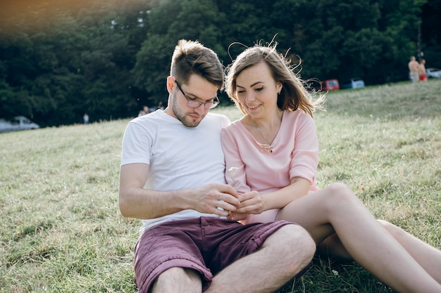 Couple looking at something in both hands