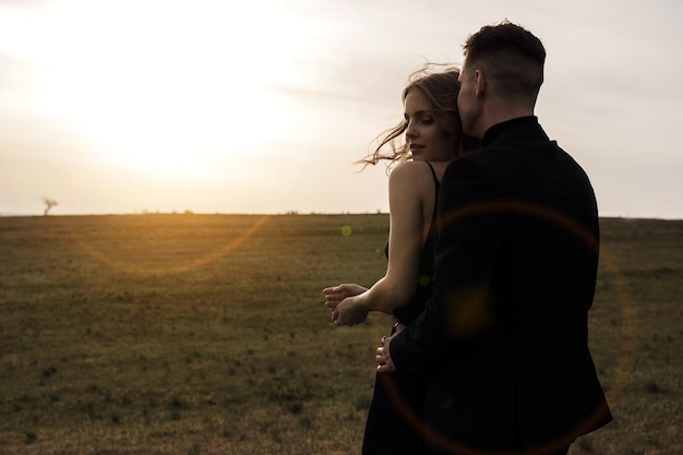 couple in love in black dress and suit