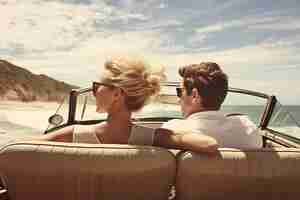 Free photo couple in love driving on the beach together