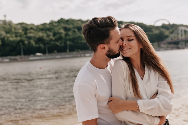 Couple in love, enjoying the summer time near the lake