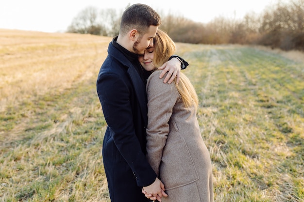 Couple in love enjoying a walk on a sunny spring day