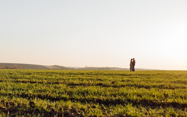 Free photo couple in love enjoying a walk on a sunny spring day